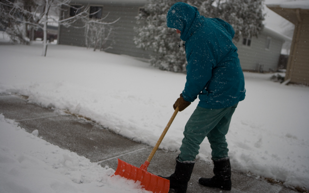 Man shoveling his sidewalk