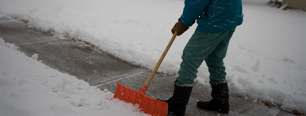 Man shoveling his sidewalk