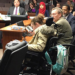 Lauren Thompson testifying at the Minnesota State Legislature