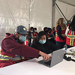 Kody Olson working at the State Emergency Operations Center