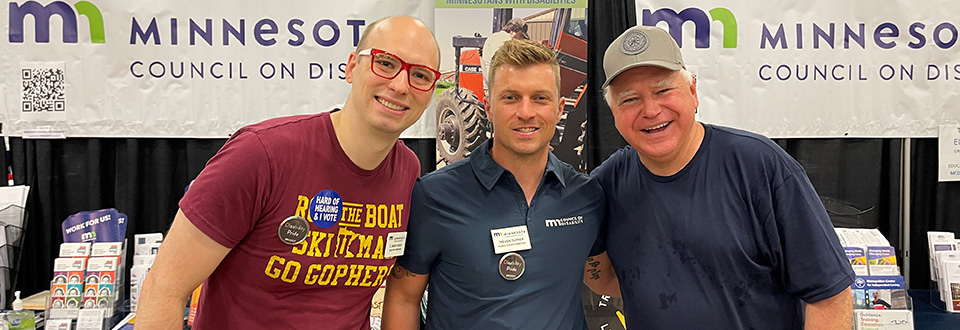 Executive Director David Dively, Public Policy Director Trevor Turner, and Gov Tim Walz at the MCD booth